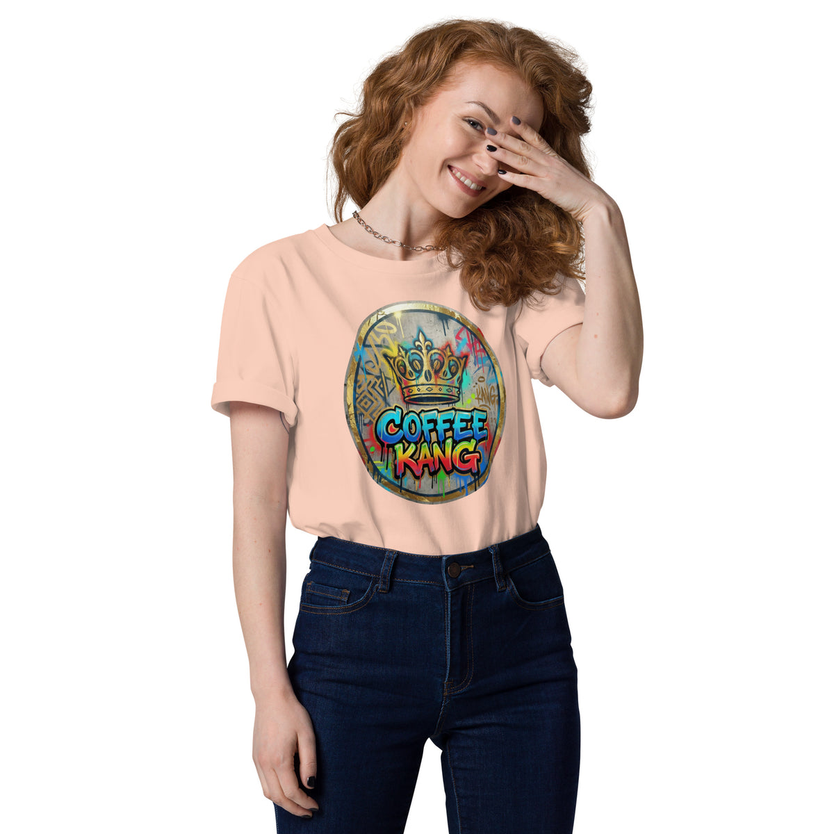 Unisex organic cotton t-shirt featuring a colorful Coffee Kang graphic design, worn by a smiling model.