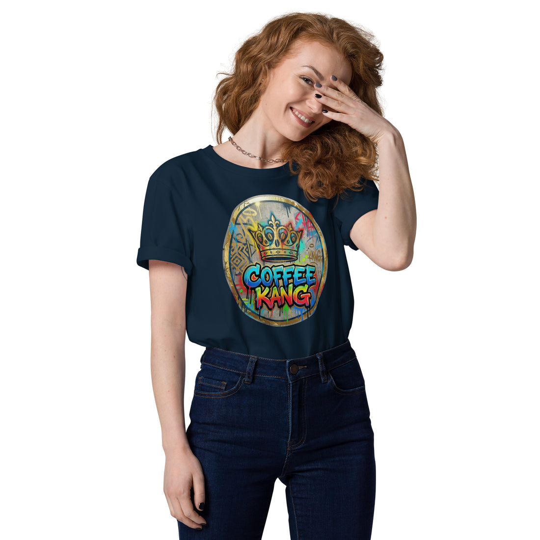 A smiling woman wearing a navy unisex organic cotton t-shirt featuring a colorful &