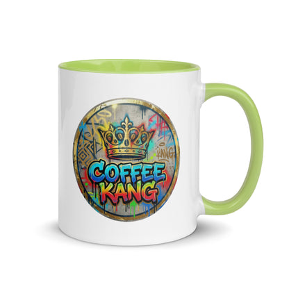 Colorful ceramic coffee mug with green rim and handle featuring &